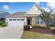 Charming one-story home with a two-car garage, brick accents, and a well-manicured front yard at 7095 Sunset Crater Pl, Lancaster, SC 29720