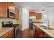 Well-equipped kitchen featuring stainless steel appliances, granite countertops, and ample cabinet space at 7095 Sunset Crater Pl, Lancaster, SC 29720
