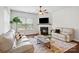 Inviting living room with a cozy fireplace, comfortable seating, and lots of natural light at 7095 Sunset Crater Pl, Lancaster, SC 29720