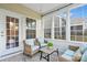 Cozy screened-in patio with comfortable seating, natural light, and a tranquil atmosphere at 7095 Sunset Crater Pl, Lancaster, SC 29720