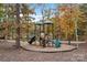 Community playground with slides and climbing features near the lake, perfect for Gathering fun at 7095 Sunset Crater Pl, Lancaster, SC 29720