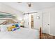 Inviting bedroom featuring a wooden bed frame, sliding barn door to the bathroom at 928 Southwest Dr, Davidson, NC 28036