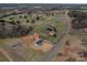 An aerial shot showcases the property's location within a vibrant neighborhood with a mix of homes and green spaces at 9303 Reepsville Rd, Vale, NC 28168