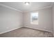 Modest bedroom features neutral carpeting, a single window and ample natural light at 9303 Reepsville Rd, Vale, NC 28168