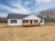 Exterior view of a single-story home with a welcoming front porch and ample yard space at 9303 Reepsville Rd, Vale, NC 28168