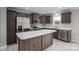 Well-equipped kitchen with stainless steel appliances, marble countertops, and dark wood cabinets at 9303 Reepsville Rd, Vale, NC 28168