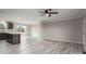 Bright living room featuring modern light wood floors, neutral paint, and an open layout to the kitchen at 9303 Reepsville Rd, Vale, NC 28168