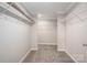Large walk-in closet offers ample storage with wire shelving and neutral carpeting at 9303 Reepsville Rd, Vale, NC 28168