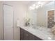 Well-lit bathroom with marble countertop, vanity, and coordinated accessories at 10933 Hunter Trail Ln, Charlotte, NC 28226