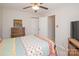 Bedroom with ceiling fan, TV, and view of closet and hall at 10933 Hunter Trail Ln, Charlotte, NC 28226