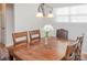 Charming dining area featuring a table, chandelier, and natural light from the window at 10933 Hunter Trail Ln, Charlotte, NC 28226