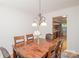 Cozy dining room with a chandelier, table, and view to the kitchen at 10933 Hunter Trail Ln, Charlotte, NC 28226