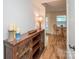 Hallway with a cabinet, decor, and leads to a cozy breakfast nook at 10933 Hunter Trail Ln, Charlotte, NC 28226