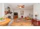 Cozy living room with a fireplace, ceiling fan, and comfortable furnishings at 10933 Hunter Trail Ln, Charlotte, NC 28226