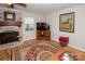 Inviting living room with a fireplace, entertainment center, and a warm, neutral palette at 10933 Hunter Trail Ln, Charlotte, NC 28226