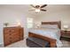 Inviting bedroom with ample natural light, ceiling fan, and wood accents at 10933 Hunter Trail Ln, Charlotte, NC 28226