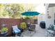 Brick-walled patio featuring shaded seating, an umbrella, and an outdoor grill at 10933 Hunter Trail Ln, Charlotte, NC 28226