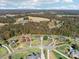 Scenic aerial view of a beautiful home nestled in a peaceful neighborhood with tree lined streets at 4225 Cheshire Glen Dr, Monroe, NC 28110