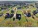 Aerial view of lovely homes in a Gathering-friendly neighborhood with mature trees and landscaping at 4225 Cheshire Glen Dr, Monroe, NC 28110