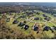 Wide aerial view highlighting real estate nestled in a quiet neighborhood with mature trees at 4225 Cheshire Glen Dr, Monroe, NC 28110