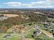 Panoramic aerial view showcases homes in a serene neighborhood with lush greenery and foliage at 4225 Cheshire Glen Dr, Monroe, NC 28110