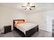 Bedroom with soft natural light features a neutral color scheme and ceiling fan at 4225 Cheshire Glen Dr, Monroe, NC 28110