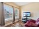 Bedroom featuring a comfortable recliner, large window, and a television with a tropical display at 4225 Cheshire Glen Dr, Monroe, NC 28110