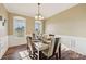 Dining room with decorative table setting and natural light from large windows at 4225 Cheshire Glen Dr, Monroe, NC 28110