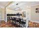 Kitchen with a large island with bar seating and stainless steel appliances at 4225 Cheshire Glen Dr, Monroe, NC 28110