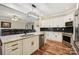 Open kitchen with stainless steel appliances, a large island, and black backsplash at 4225 Cheshire Glen Dr, Monroe, NC 28110