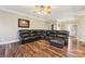 Spacious living room with a sectional sofa and hardwood floors at 4225 Cheshire Glen Dr, Monroe, NC 28110