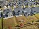 Overhead shot of backyards and rooftops showing outdoor living areas and well-kept lawns at 535 Red Wolf Ln, Clover, SC 29710