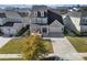 An aerial view of a two-story home featuring a well-manicured lawn and a two-car garage at 535 Red Wolf Ln, Clover, SC 29710