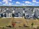 Aerial view of the backyard featuring a lawn, soccer goal, patio, and view of surrounding homes at 535 Red Wolf Ln, Clover, SC 29710