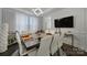 Bright dining room with large table, modern lighting, and elegant decor perfect for entertaining at 535 Red Wolf Ln, Clover, SC 29710