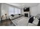 Cozy living room with fireplace, large sofa, and natural light, creating a welcoming atmosphere at 535 Red Wolf Ln, Clover, SC 29710