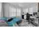 Bright sitting area/bedroom bathed in natural light features a stylish desk, modern furnishings, and comfortable seating at 535 Red Wolf Ln, Clover, SC 29710