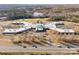 This aerial view shows a large building with parking, surrounded by trees and roads at 535 Red Wolf Ln, Lake Wylie, SC 29710