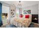 Comfortable bedroom featuring a stylish chandelier, patterned wallpaper, and large windows at 535 Red Wolf Ln, Lake Wylie, SC 29710
