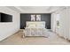 This primary bedroom features artwork, a tray ceiling, carpet, and natural light at 535 Red Wolf Ln, Lake Wylie, SC 29710