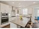 Bright kitchen features granite countertops, stainless steel appliances, an island with seating, and pendant lighting at 535 Red Wolf Ln, Lake Wylie, SC 29710