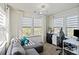 This office features a large gray couch and a desk in front of a window at 535 Red Wolf Ln, Lake Wylie, SC 29710