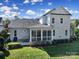 Aerial view of house with backyard and screened porch at 1017 N Sharon Amity Rd, Charlotte, NC 28211