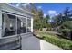 Landscaped backyard with screened porch and patio at 1017 N Sharon Amity Rd, Charlotte, NC 28211