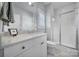 Clean bathroom with white vanity, shower, and toilet at 1017 N Sharon Amity Rd, Charlotte, NC 28211