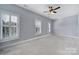 Bright bedroom featuring ceiling fan and window shutters at 1017 N Sharon Amity Rd, Charlotte, NC 28211