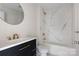 Modern bathroom with marble shower and gold fixtures at 103 2Nd Nw Ave, Hickory, NC 28601