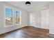 Well-lit bedroom, featuring hardwood floors and two windows at 103 2Nd Nw Ave, Hickory, NC 28601