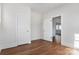 Bedroom with hardwood floors, and doors leading to other rooms at 103 2Nd Nw Ave, Hickory, NC 28601