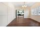 Bright dining room with hardwood floors and views into the kitchen at 103 2Nd Nw Ave, Hickory, NC 28601